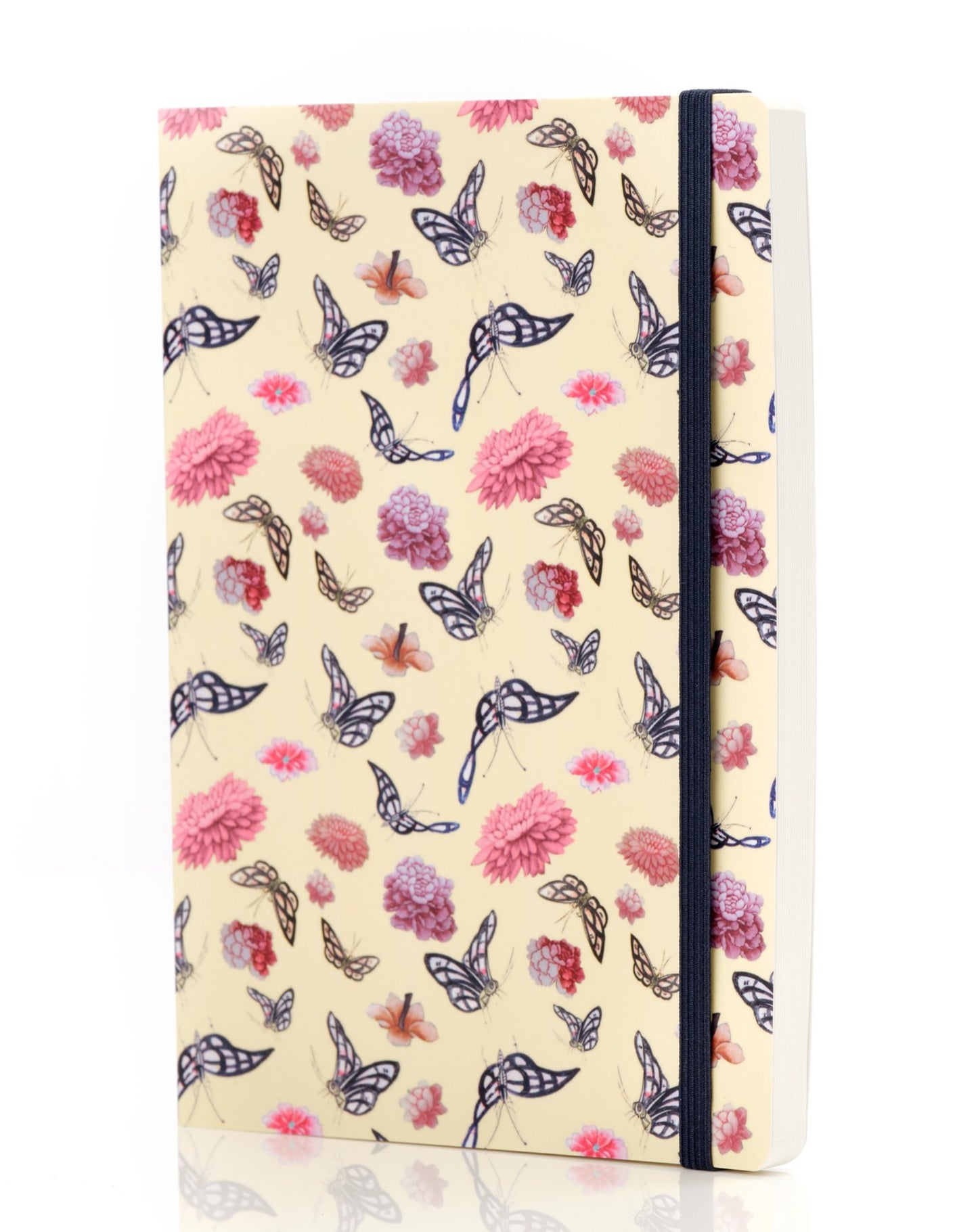 Journal with a butterfly and flower design standing upright with a band of black elastic on the right hand side.