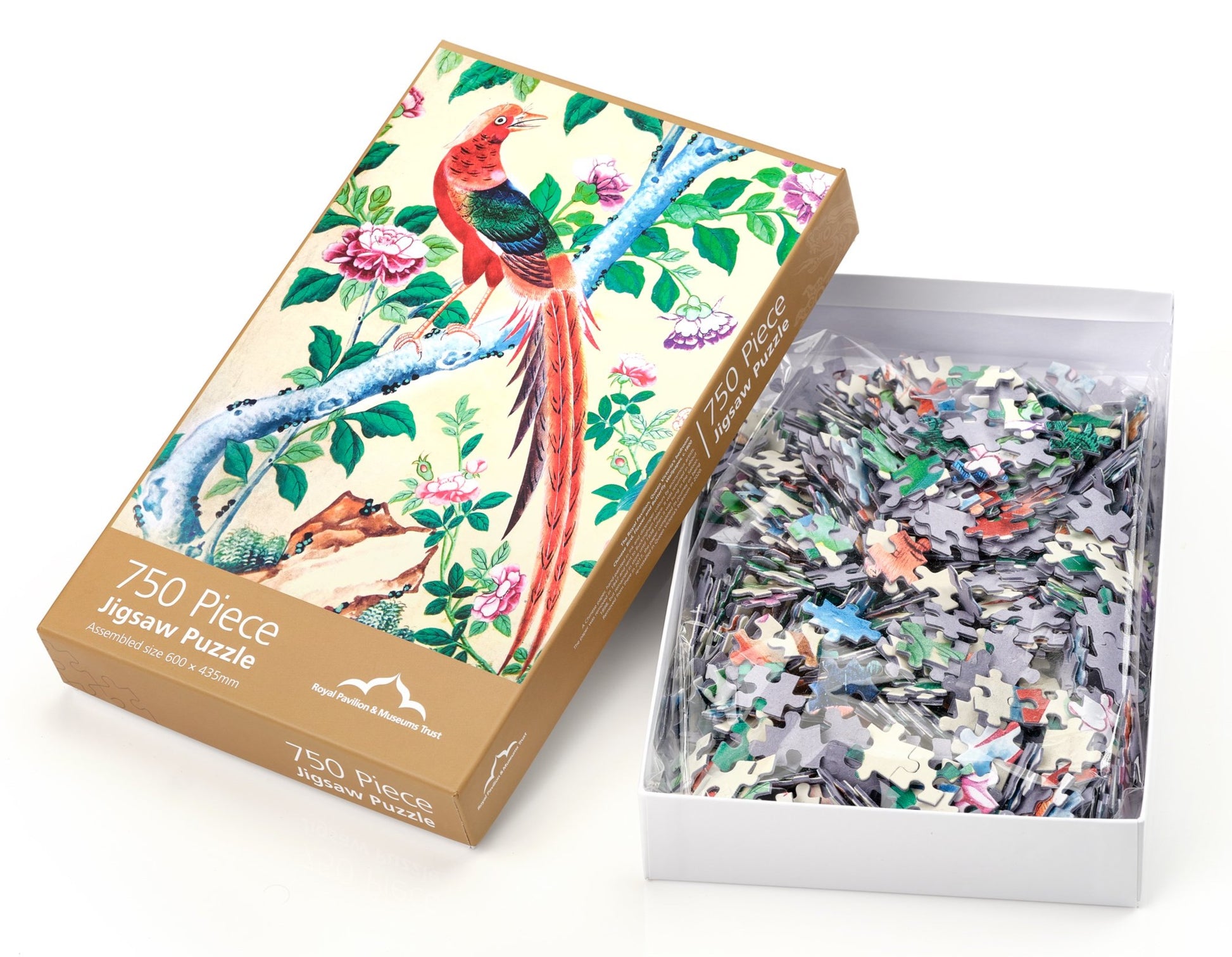 An opened box containing individual jigsaw pieces.