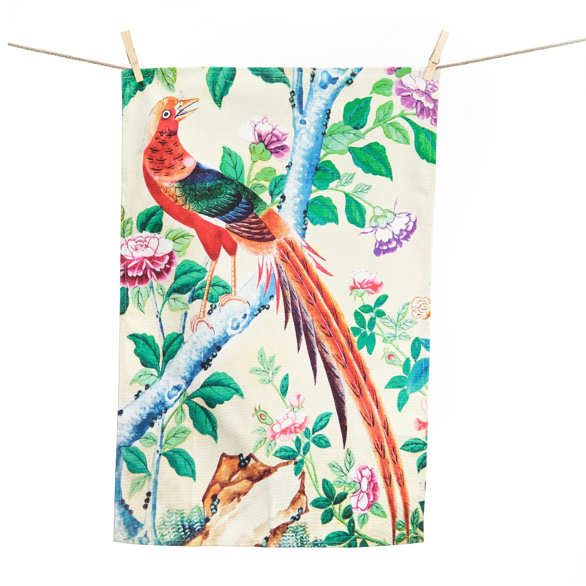 A tea towel hanging on a washing line. The design features a large pheasant perched on a tree branch surrounded by flowers and leaves..